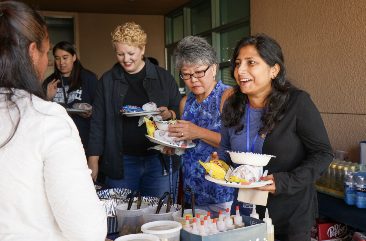 SERVING APPRECIATION: Instructional assistant Rita Day receives a complimentary lunch at the fall luncheon